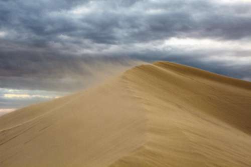 sand highland landscape desert clouds