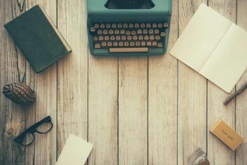 wood typewriter book pine cone eyeglasses