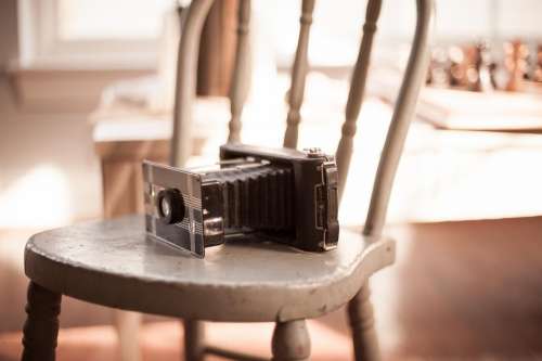 camera old vintage film chair
