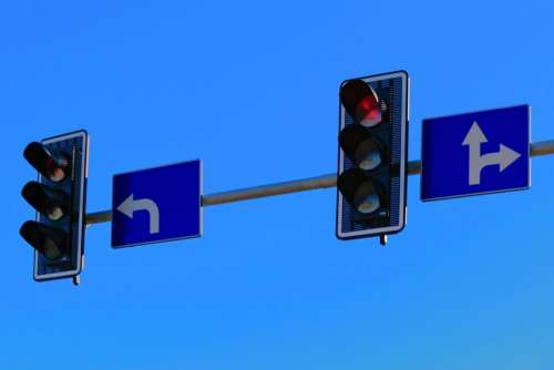 blue sky traffic light arrow