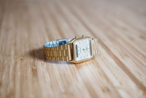 gold watch fashion accessory wooden