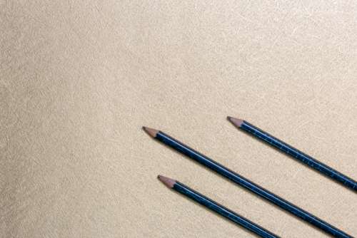 pencils flat lay background gold shiny