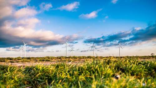 windmill structure green grass field