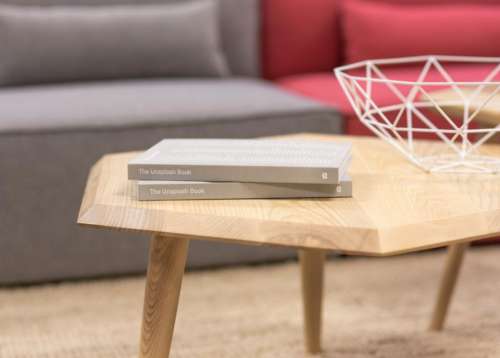 gray books unsplash table wood