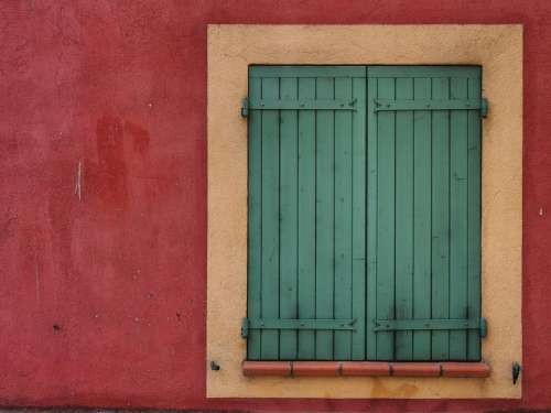 red green shutters window wall