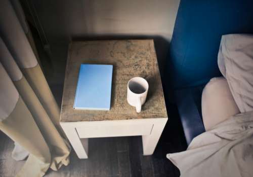 coffee blue notepad bed table