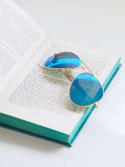 blue sunglasses book open book read
