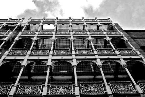 building architecture sky clouds black and white