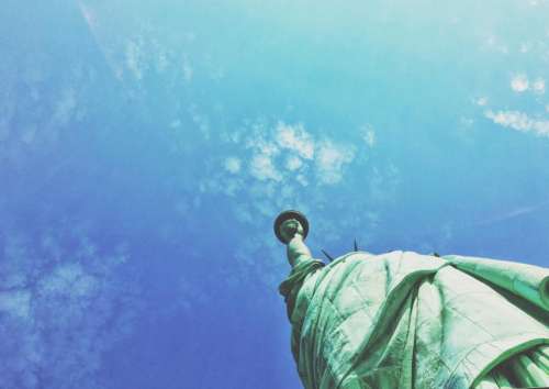 statue of liberty blue sky clouds summer