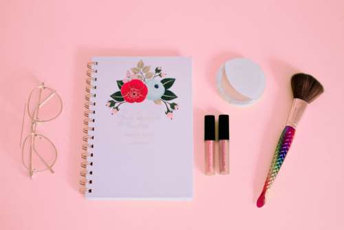 feminine notepad pink makeup brush