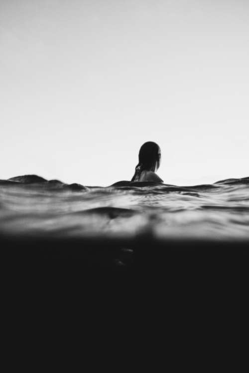 woman swimming black & white swim adventure