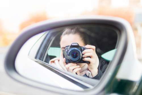 woman photograph mirror car transport
