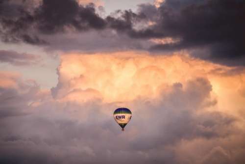 hot air balloon cloudy sky sunset