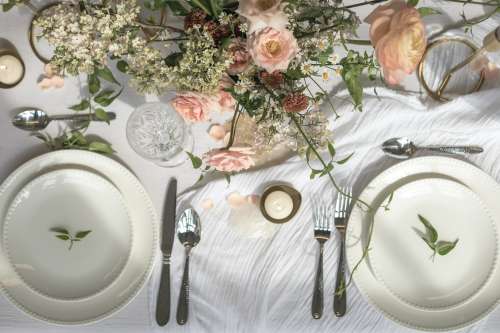 A Dining Table Filled With Floral Decoration Photo