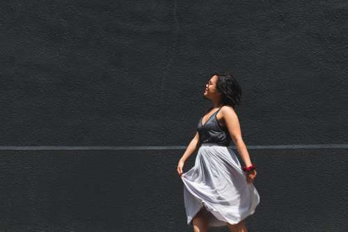 A Woman In Grey Summer Clothes Photo