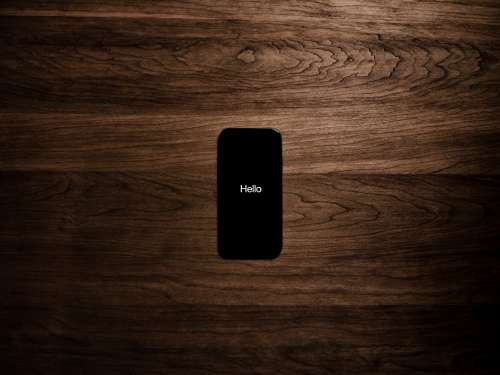 Black Smartphone Displays The Word Hello Photo