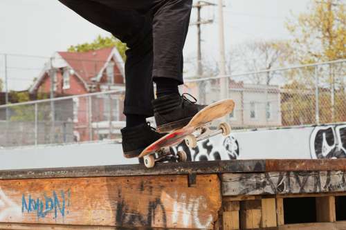 Grinding A Ledge With A Skateboard Photo