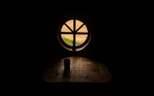 Light On A Wooden Table And Mug Photo