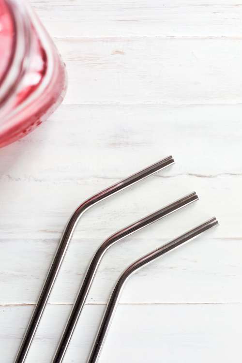 Metal Drinking Straws On Wood Photo