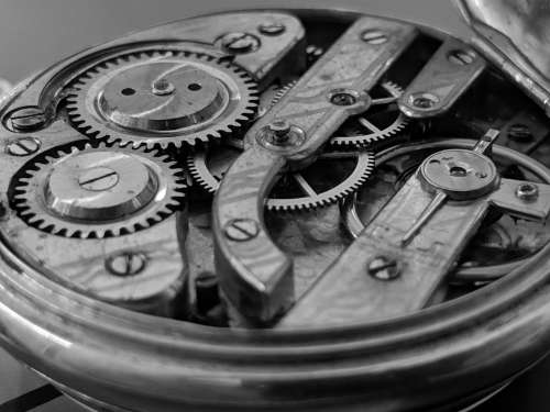 Open Timepiece Exposing Cogs And Gear Wheels Photo