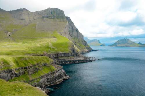 Pristine Mountainous Coastline Off Faroe Islands Photo