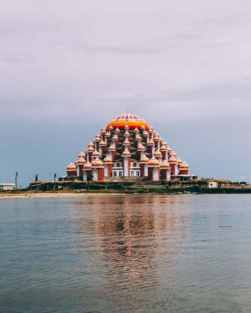 Waterfront Temple Reflects Into Water Photo