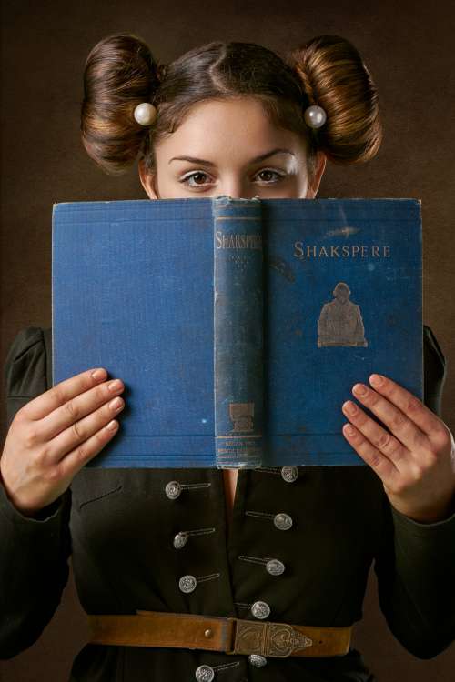 Young Woman Holds An Antique Book Photo