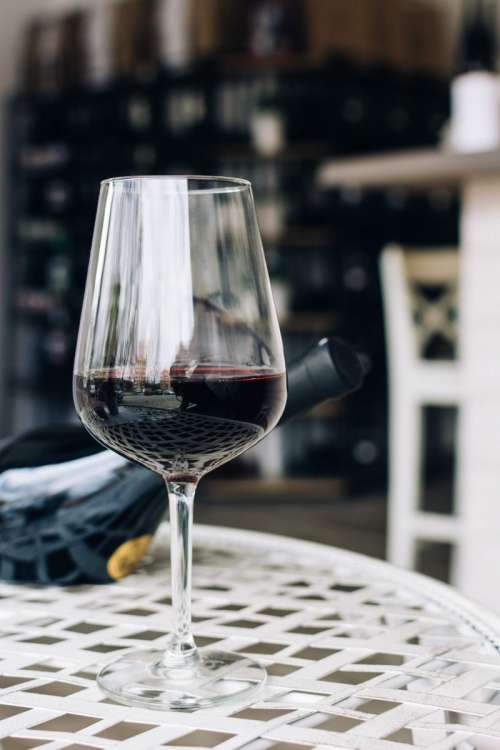 Glass of red wine in a wine shop