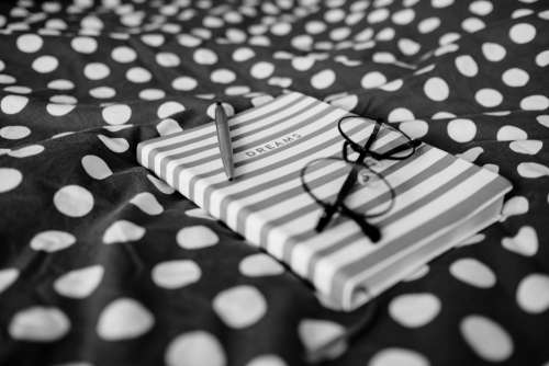Dreams notebook and glasses