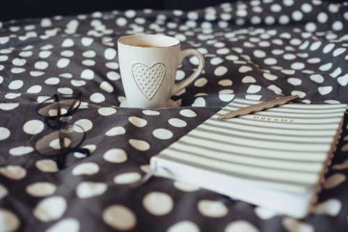 Dreams notebook, glasses and coffeemug