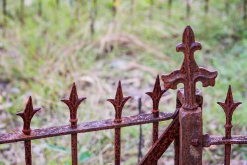 iron railing rusty cemetery plot
