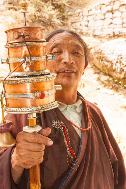 prayer wheels   man   Tibet   tranquility   meditation
