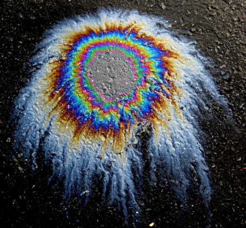 abstract background oil stain iridescent pavement