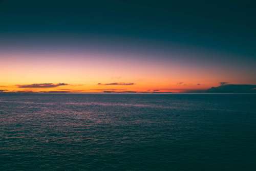 Washed Colorful Sunset Over the Sea Free Photo