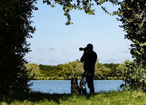 Photographer Male Photographer Man And Dog Lake