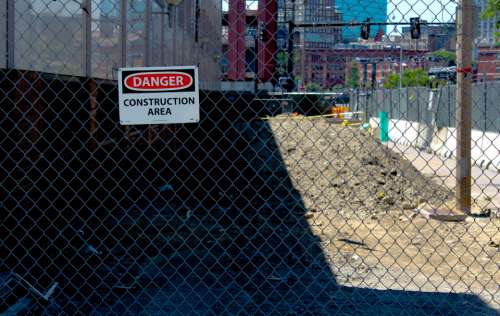 danger fence construction site sign