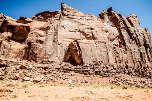 A Cave In The Side Of A Sandstone Hill In The Desert Photo