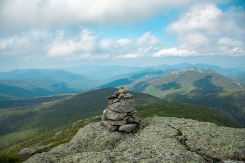A Small Pebble Pile On Top A Mountain Photo