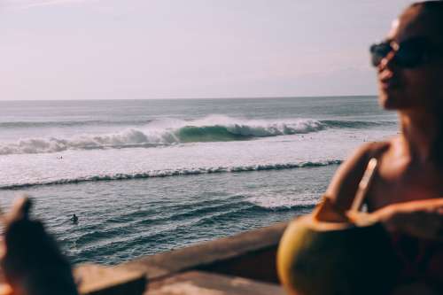 Crashing Ocean Waves In Distance Behind Silhouette Of Woman Photo