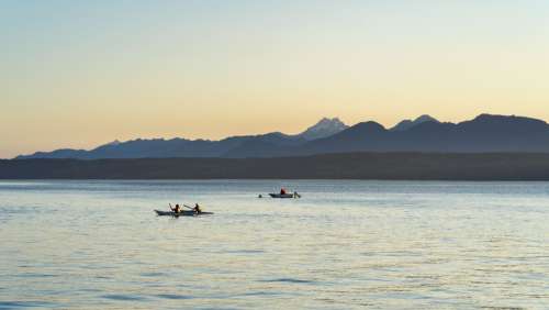 Kayakers And The Mountains Photo