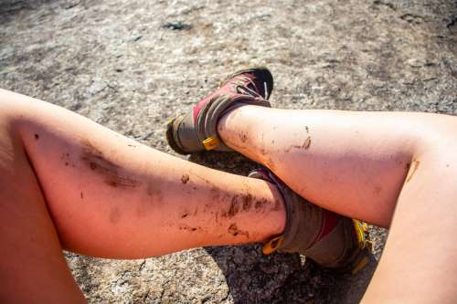 Mud-Spattered Woman Hiker's Legs Photo
