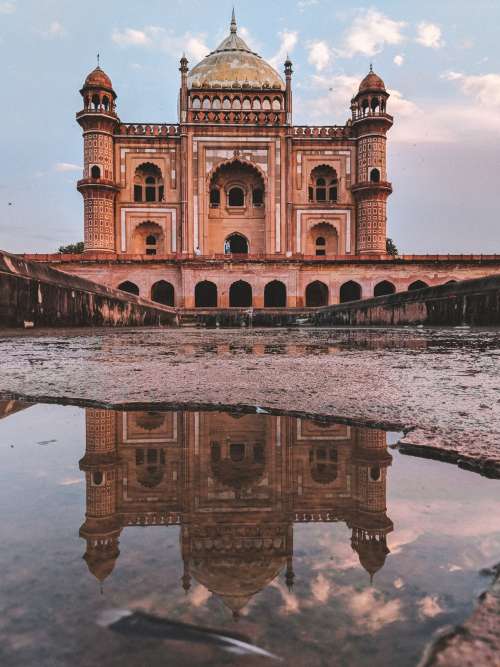 Puddle Reflects Mosque Photo