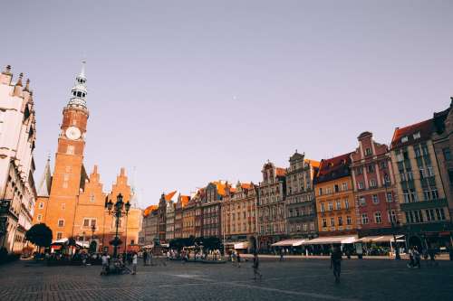 Sunset Over A Red Brick Tower In A Cobbled Piazza Photo