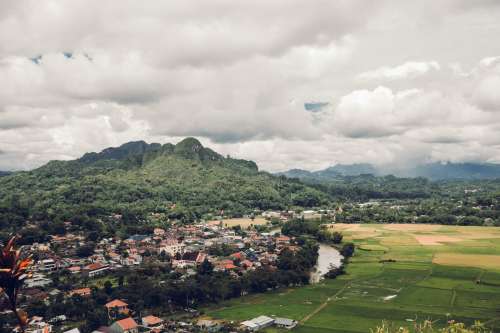 Valley Of Rice Farms Surrounded By Lush Mountains Photo