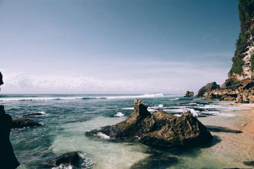 White Sand Beach Scattered With Large Boulders Photo