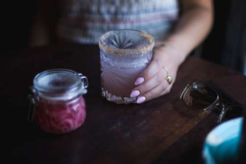 Woman Holds Cocktail Glass Photo