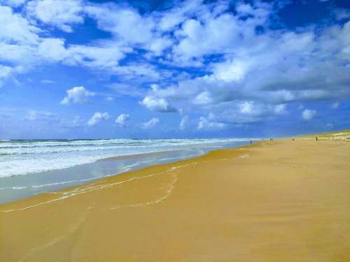 Beach sky ocean sand waves