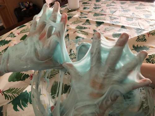 slime hands making slimey blue