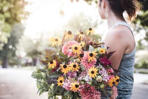 woman holding bouquet flowers girl