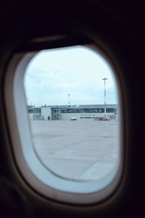 Airport Through Plane Window Photo